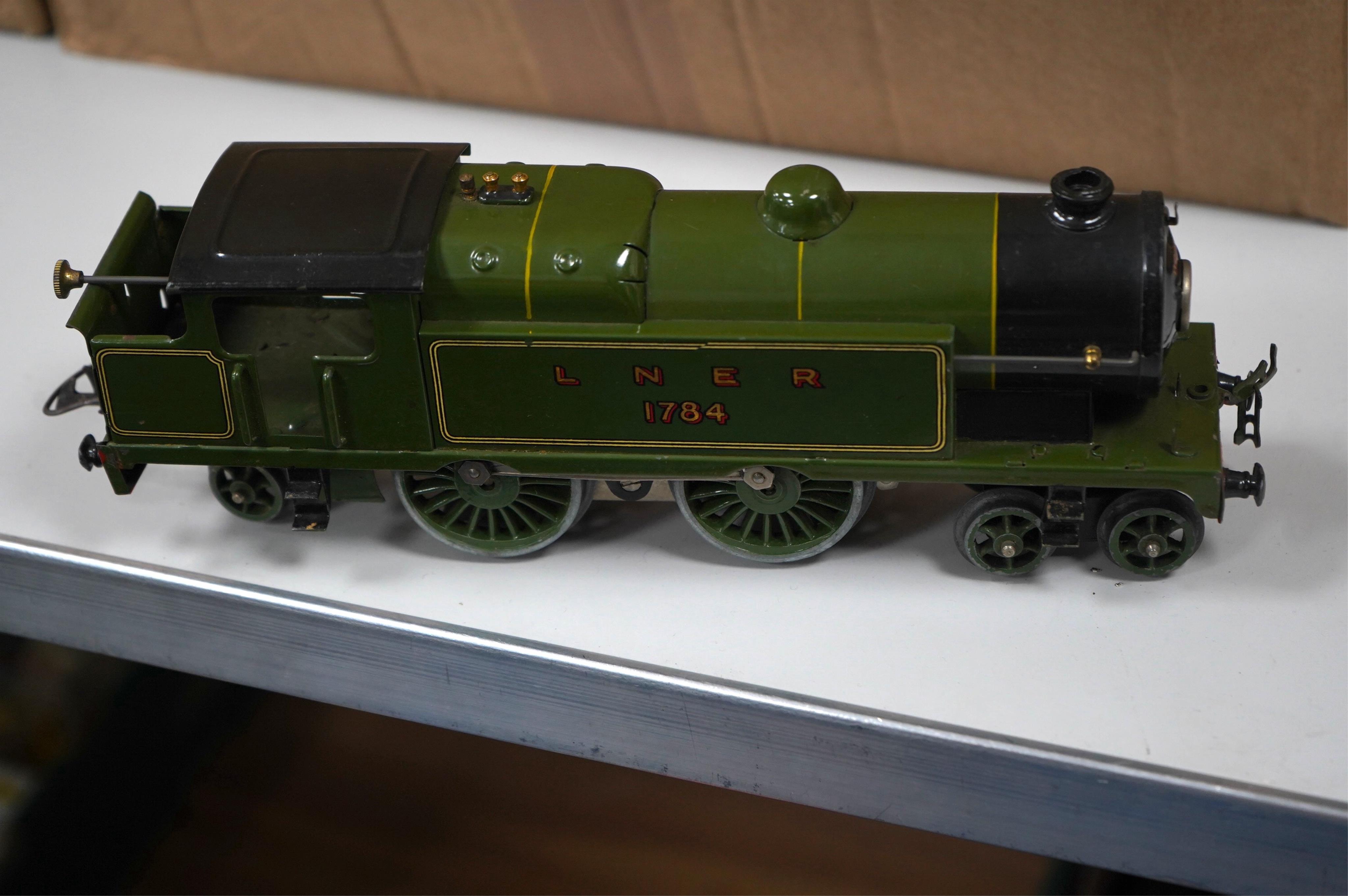 A collection of Hornby 0 Gauge tinplate railway including; a No.2 Special LNER 4-4-2T locomotive for three rail electric running, 1784, two boxed No.2 LNER teak Corridor Coaches, a boxed No.2 Lumber wagon, four freight w